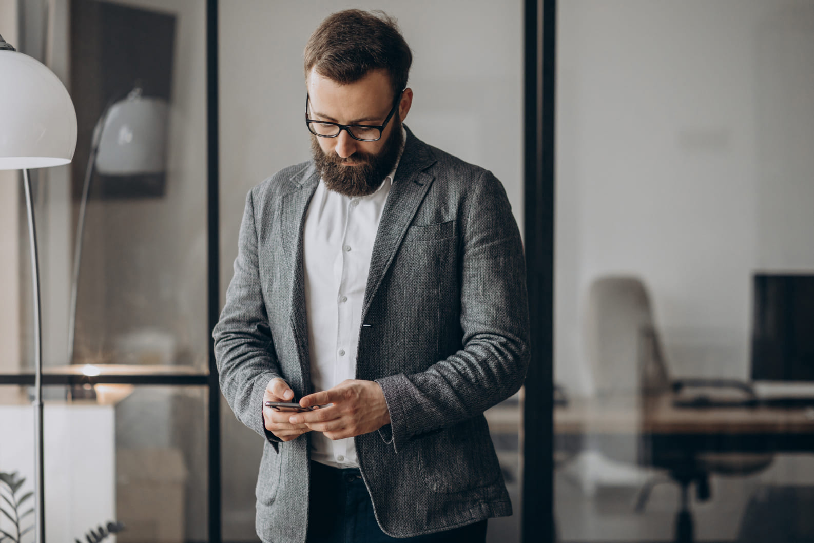 handsome business man using phone office