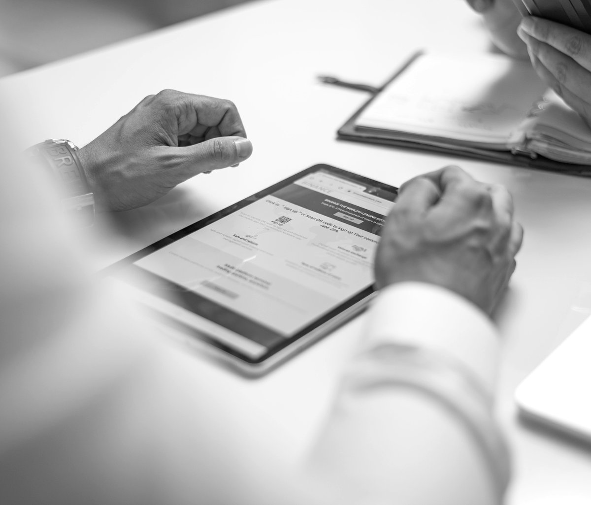 Business team reviewing a modernized web application on a tablet